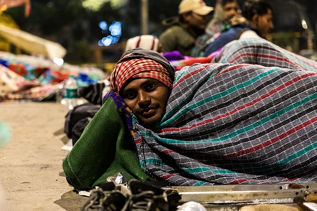 A protester smiles during a conversation.