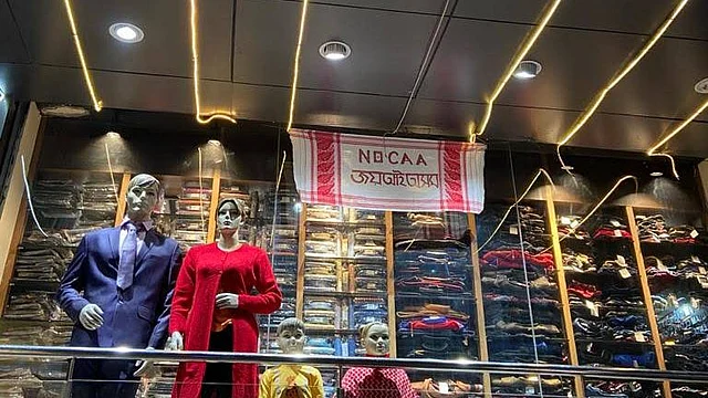 A shop in Assam’s Tezpur with a Gamosa as an anti-CAA banner.