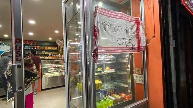 A shop in Assam’s Tezpur with a Gamosa as an anti-CAA banner.