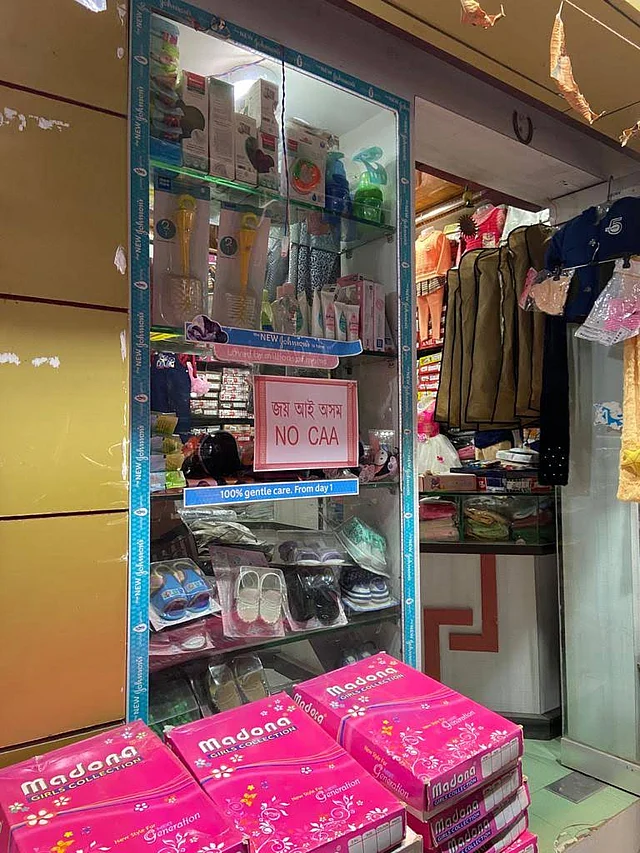 A shop in Assam’s Tezpur with a Gamosa as an anti-CAA banner.