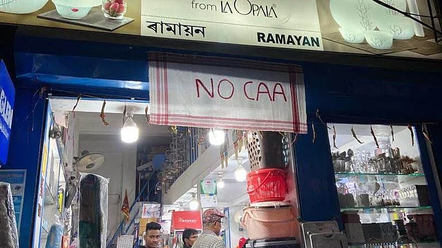 A shop in Assam’s Tezpur with a Gamosa as an anti-CAA banner.