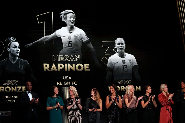 US Megan Rapinoe is seen on the screen after she awarded as the best female soccer player during the Golden Ball award ceremony at the Grand Palais in Paris, Monday, Dec. 2, 2019. 