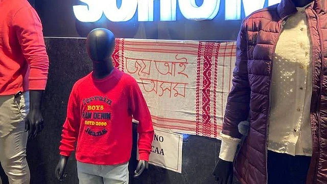 A shop in Assam’s Tezpur with a Gamosa as an anti-CAA banner.