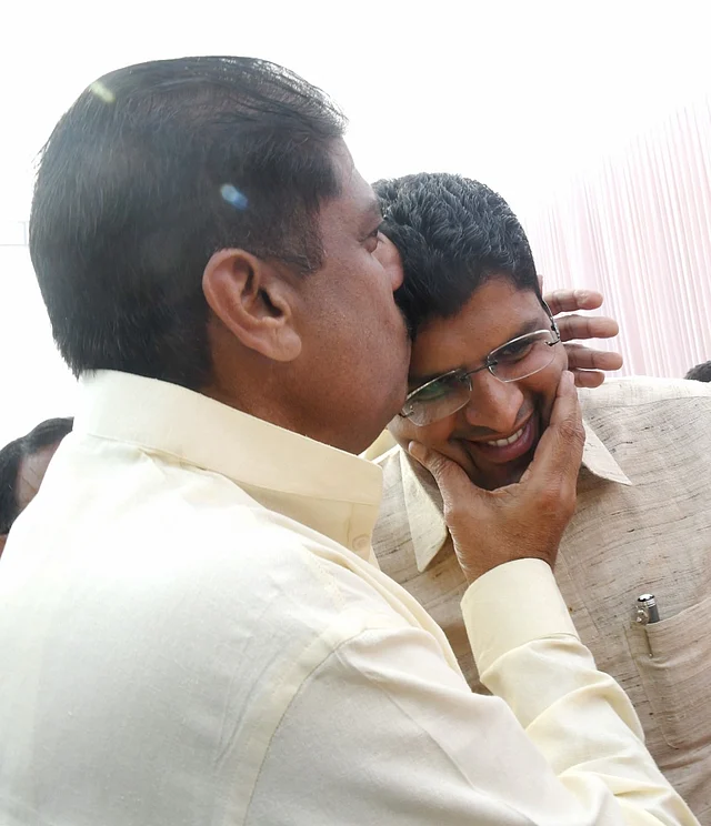 Haryana Deputy Chief Minister being greeted by his father, Ajay Singh Chautala after the latter was released from jail to see his son take oath after allying with the BJP to form the government in Haryana.