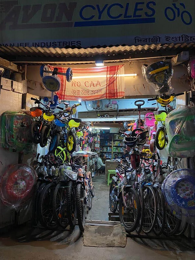 A bicycle shop in Assam’s Tezpur with a Gamosa as an anti-CAA banner.