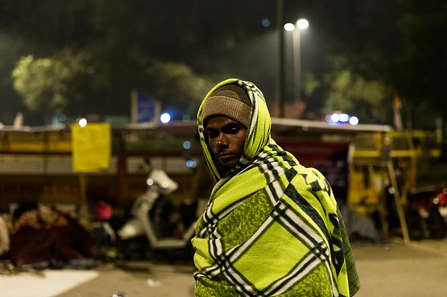 A candidate watches over his colleagues as they sleep