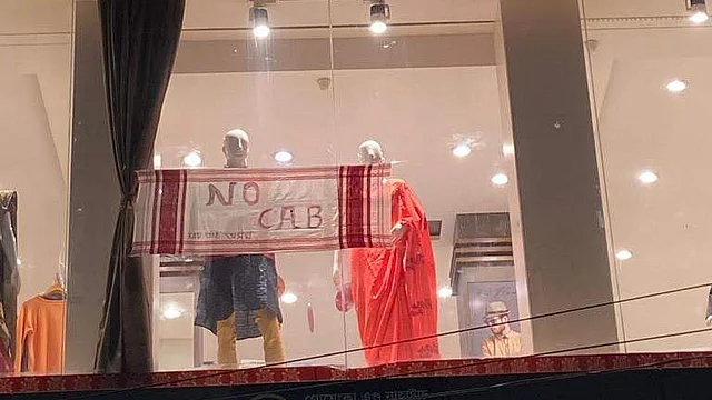 A shop in Assam’s Tezpur with a Gamosa as an anti-CAA banner.