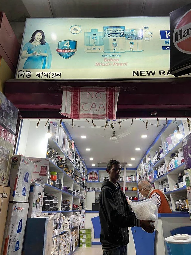 A shop in Assam’s Tezpur with a Gamosa as an anti-CAA banner.