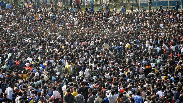 Protestors gather to defy the curfew at Latasil Ground in Guwahati on Thursday.
