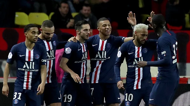 PSG’s Kylian Mbappe, center, celebrates with teammates after scoring his side’s fourth goal during the French League One soccer match between Monaco and Paris Saint-Germain.