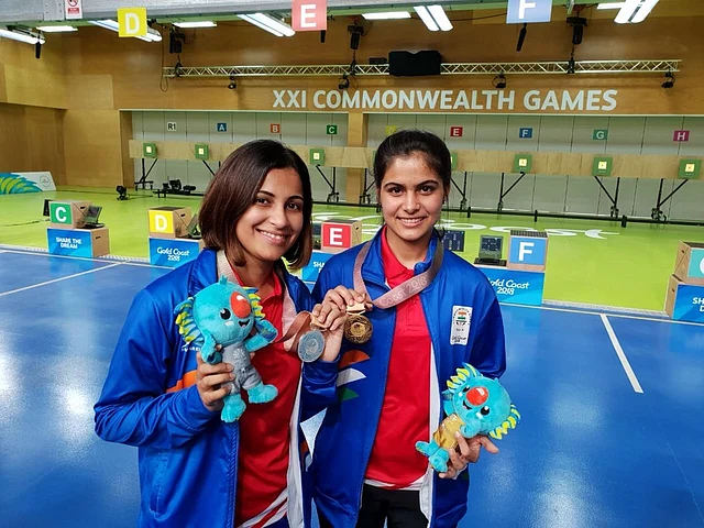 CWG Gold medallist Manu Bhaker and Silver medallist Heena Sidhu of India pose with their medals.