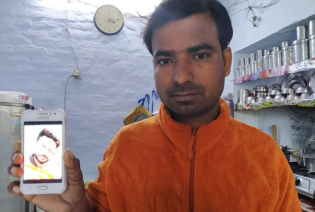 Saif’s brother shows his photo. 25-year-old Saif had stepped out that day to deliver a lunch box.