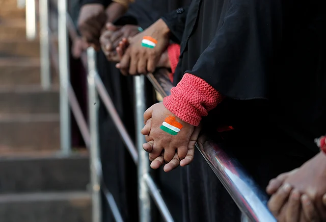 Muslim women hold hands to form human chain at Jama Masjid in protest against the new citizenship law, in New Delhi on Thursday, 30 January.