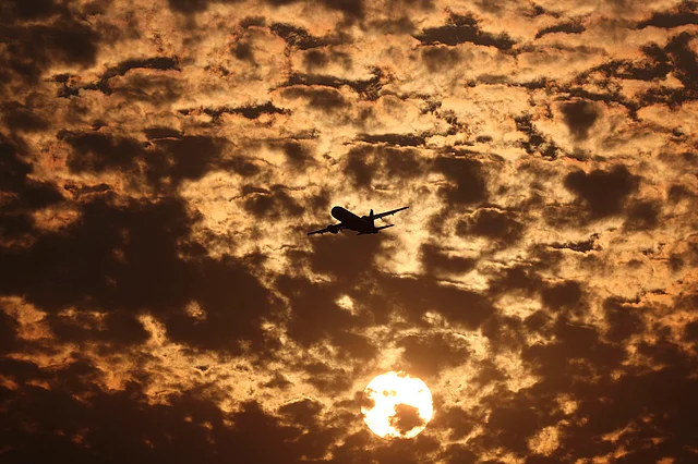 A aircraft is silhouetted against the clouds as it takes off during sunset in Ahmedabad, on Monday, 27 January.