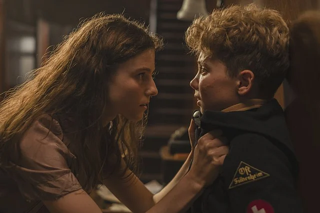 Roman Griffin Davis and Thomasin Mackenzie in a still from <i>Jojo Rabbit</i>.