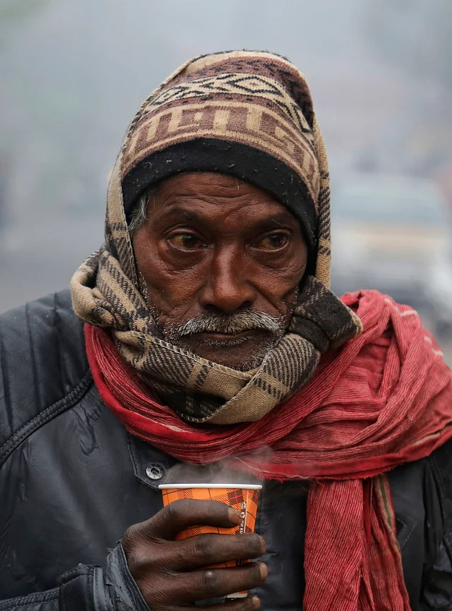 An Indian man sips tea on a cold and foggy morning in Jammu, India, Tuesday, 31 Dec 2019.