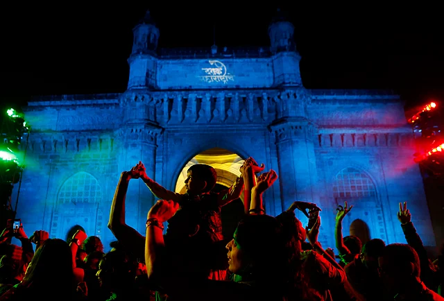People celebrate New Year’s Eve in front of the iconic Gateway of India in Mumbai, India, Tuesday, 31 Dec 2019.