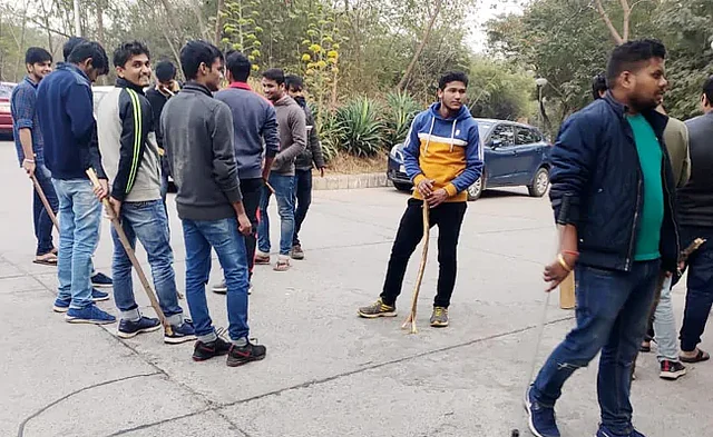 Shiv Poojan Mandal (on the left, yellow hoodie) and Vikas Patel (right, green T-shirt and blue jacket)