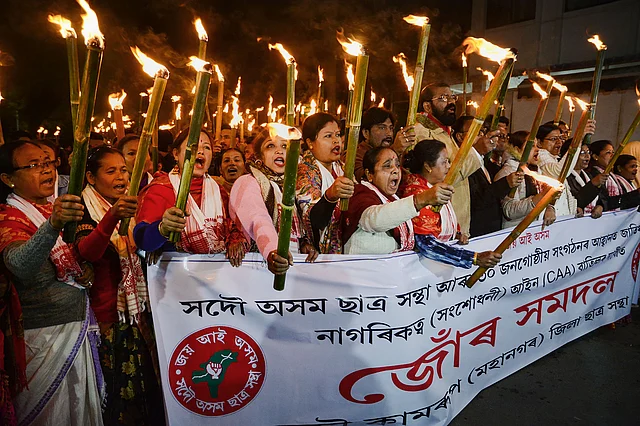 Activists of All Assam Students Union take part in a torch rally against the amended Citizenship Act, in Guwahati, Friday, 3 Jan 2020.