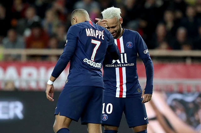 PSG’s Neymar, right, celebrates with PSG’s Kylian Mbappe after scoring his side’s second goal during the French League One soccer match between Monaco and Paris Saint-Germain at the Louis II stadium in Monaco.