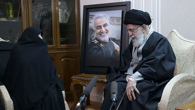 In this picture released by the official website of the office of the Iranian supreme leader, Ayatollah Ali Khamenei meets the family of Iranian Revolutionary Guard General Qasem Soleimani.