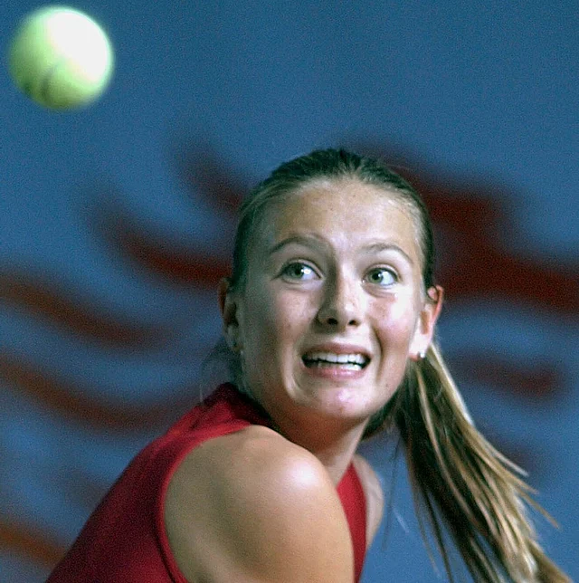 In this Jan. 3, 2003, file photo, Maria Sharapova of Russia eyes to the ball during her semifinal match against Monica Seles of the United States in the Hong Kong Ladies Challenge tennis tournament in Hong Kong.