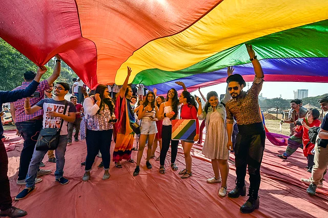 Supporters and members of LGBT community hold the rainbow flag as they participate in a Queer Azadi March 2020 at Azad Maidan in Mumbai, Saturday, 1 February.