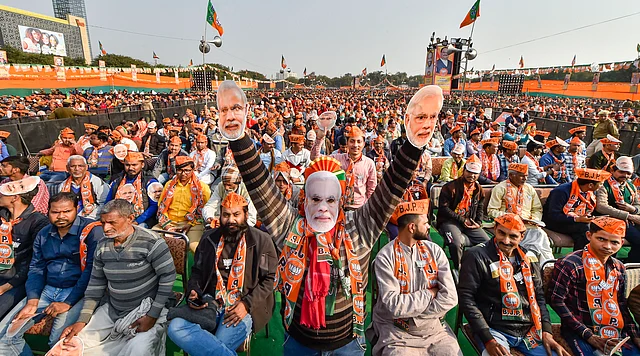 BJP supporters attend an election campaign rally led by Prime Minister Narendra Modi (unseen) ahead of the State Assembly polls, at Dwarka in New Delhi, Tuesday, 4 February 2020.