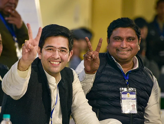 AAP leader Raghav Chadha displays the victory sign as early trends show the party’s victory in the Delhi Assembly poll results, at a counting centre in New Delhi.