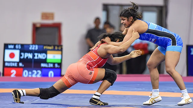 Sakshi Malik in action against Japan’s Naomi Ruike in the 65 kg final.