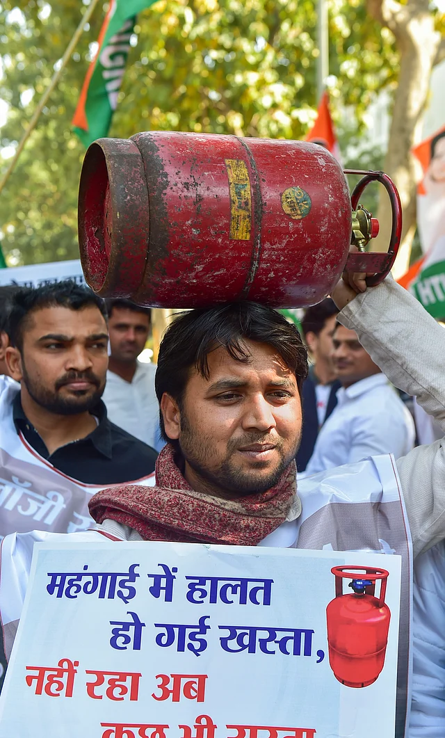 Indian Youth Congress members during a protest against the LPG cylinder price hike outside Petroleum Ministry at Shashtri Bhawan, in New Delhi, on Friday.