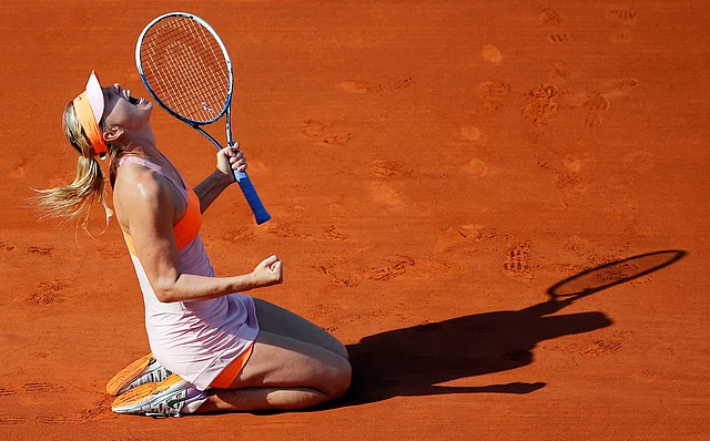 In this Jule 7, 2014, file photo, Russia’s Maria Sharapova reacts after defeating Romania’s Simona Halep during their final match of the French Open tennis tournament at the Roland Garros stadium, in Paris, France. 