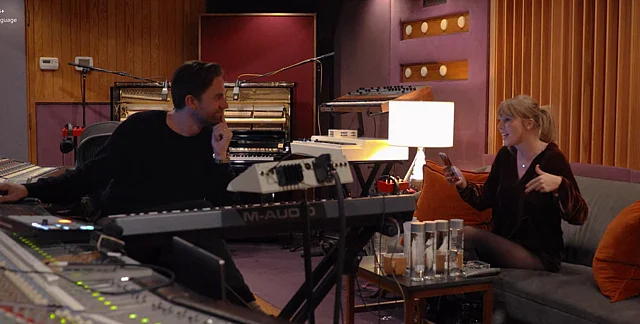 Taylor Swift jamming with a colleague.