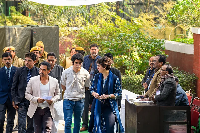 Congress general secretary Priyanka Gandhi Vadra along with her husband Robert Vadra and son Raihan Vadra, who is a first-time voter, arrive to cast their vote during the Delhi Assembly elections at a polling station, in Lodhi Estate area of New Delhi, Saturday, 8 February.