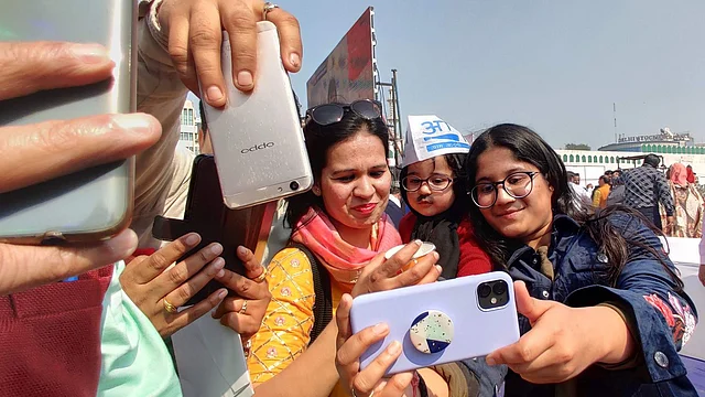 One-year-old Avyaan looks tired as he poses with selfie-seekers.