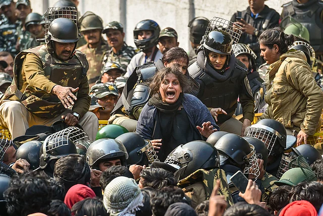 A woman protester shouts as police stops many during a march against CAA, NRC and NPR, near Jamia Nagar on Monday.