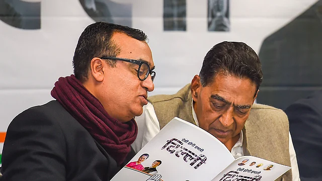 DPCC President Subhash Chopra (R) with party leader Ajay Maken at the release of the Congress manifesto for the Delhi Assembly elections, at a press conference at the DPCC office, in New Delhi, Sunday, Feb. 2, 2020.