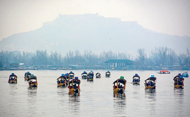 Batch of 25 foreign envoys ride on a shikara at Dal Lake, in Srinagar, on Wednesday.