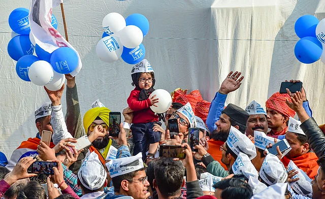 AAP supporters cheer for Delhi CM and AAP Convenor Arvind Kejriwal (unseen), following the party’s victory in the Assembly elections on Tuesday.