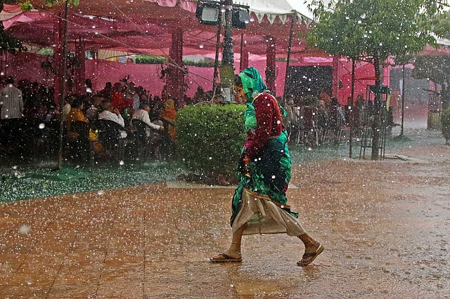 A woman walks during a hailstorm, in Jaipur, Thursday, 5 March, 2020.