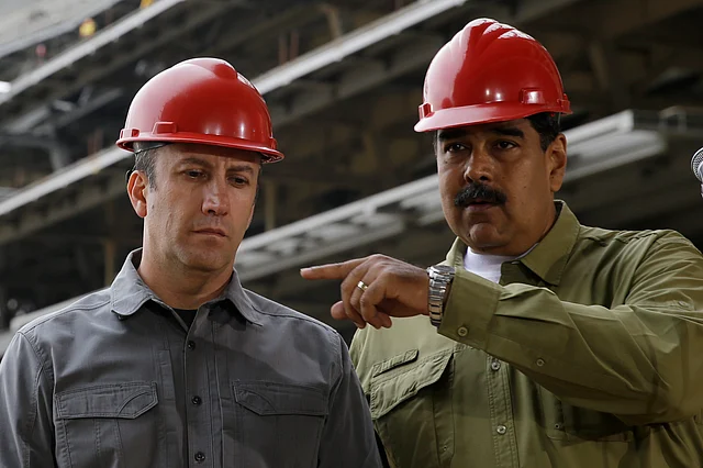 In this 19 May 2018 file photo, Venezuela’s President Nicolas Maduro, right, and Vice President Tareck El Aissami tour La Rinconada baseball stadium that is under construction on the outskirts of Caracas, Venezuela.