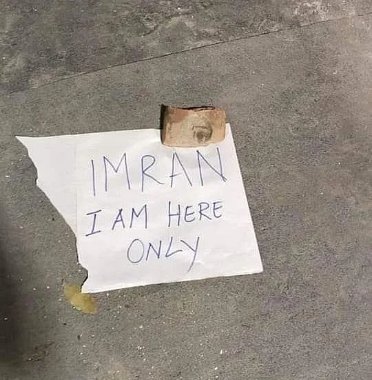 A protester leaves a piece of paper with their name on it at the Park Circus protest venue.