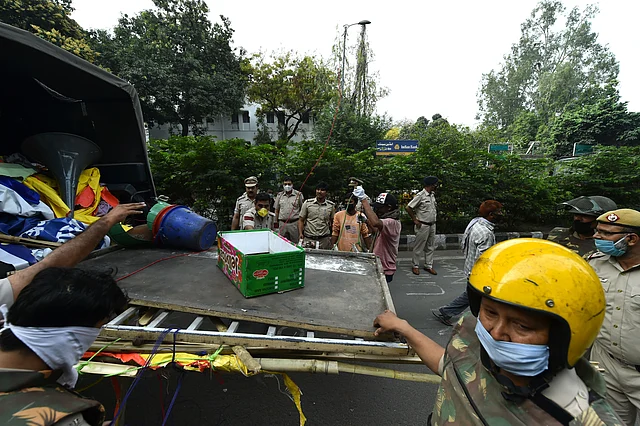 Items removed from Shaheen Bagh protest site being taken into a truck.