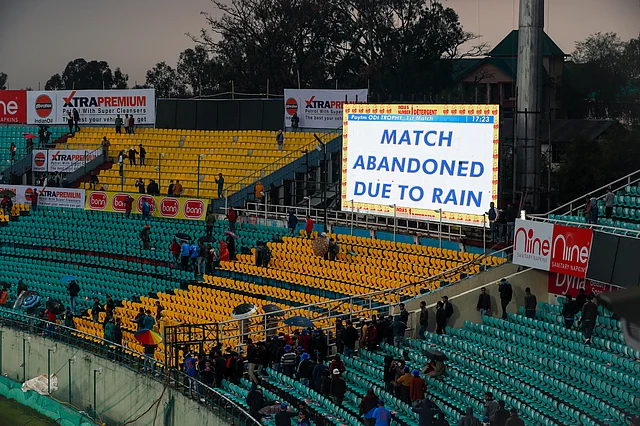 A large screen announces that the first of the three one-day international cricket matches between India and South Africa has been abandoned due to rain in Dharmsala, India, Thursday, 12 March 2020.