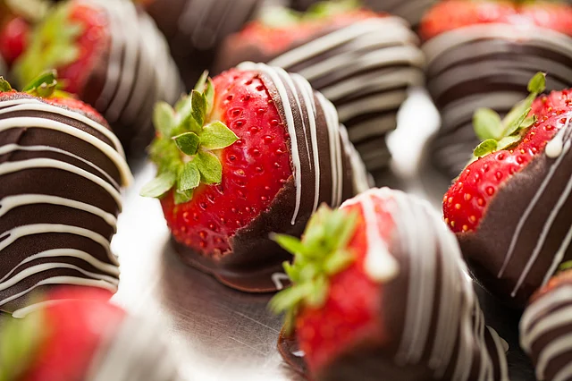 Pan dipped in dark chocolate for the adults, chocolate coated strawberries or fruit skewers with honey can be excellent options for kids.