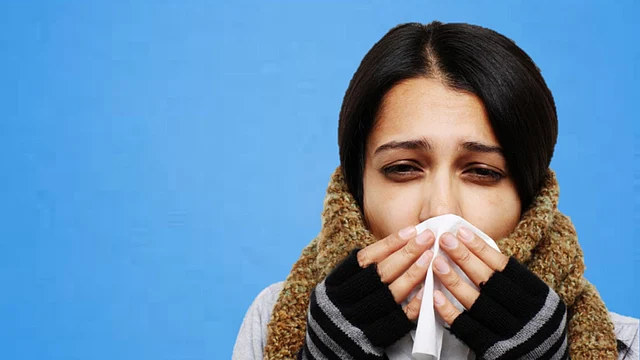 A cold presents with a runny nose or congestion and generally does not result in serious complications.