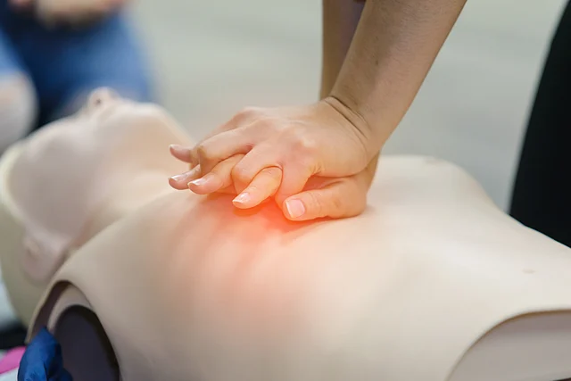 Five cycles of thirty chest compression should be given with both hands placed over the lower third of the sternum.