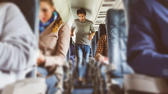 Either take a walk or just squeeze and move your calves sitting on your seat.