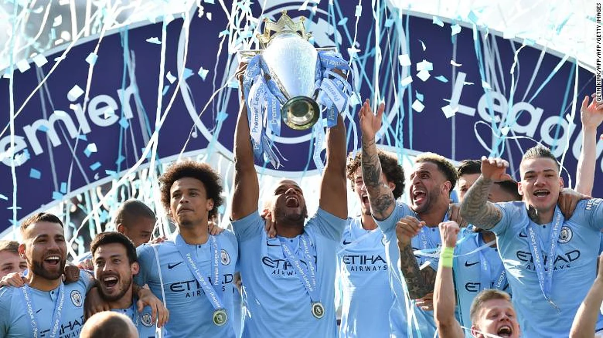 Manchester City’s players celebrate retaining the title of English Premier League