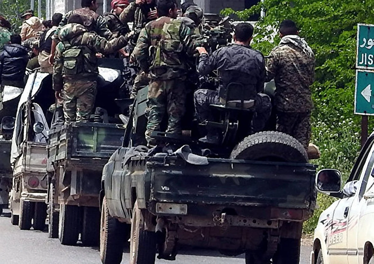Russia and Syrian forces launch attacks on militant enclaves